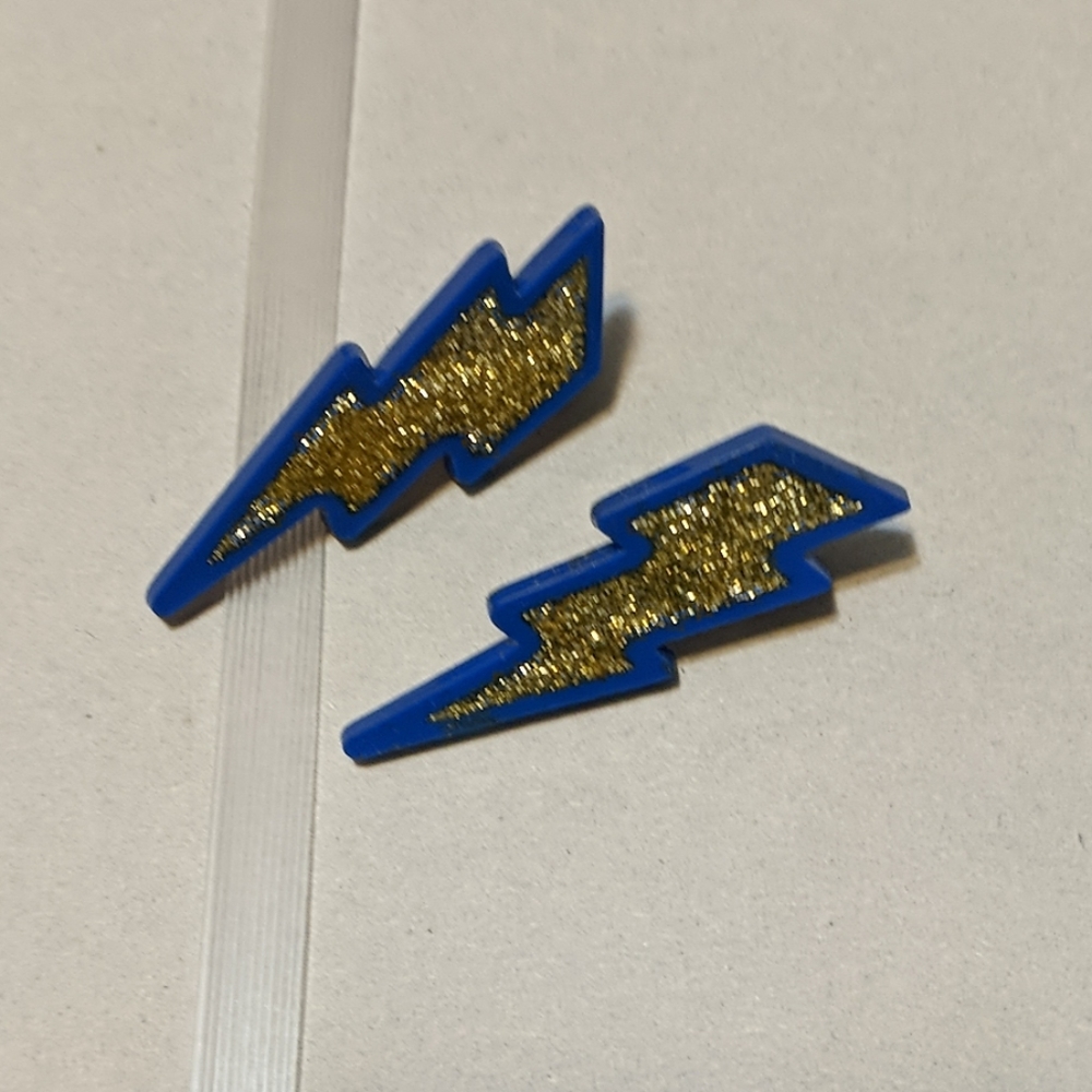 Blue and gold glitter lightning earrings.